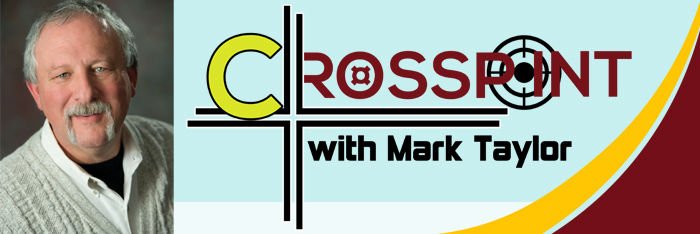 Mark Taylor next to the Crosspoint Logo